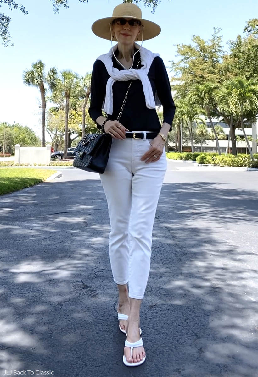 classic style over 50 chanel jumbo, black ruffle top, white jeans ootd 1
