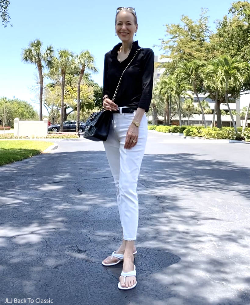 classic style over 50 chanel jumbo, black ruffle top, white jeans ootd 4