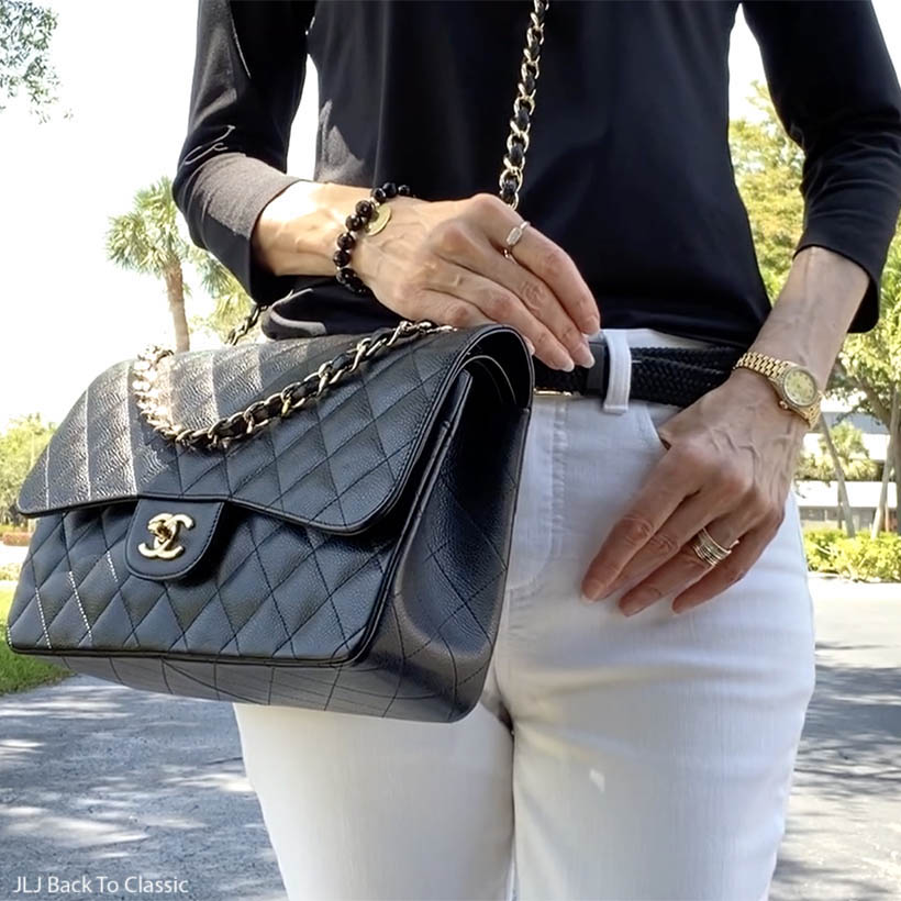 classic style over 50 chanel jumbo, black ruffle top, white jeans ootd 7